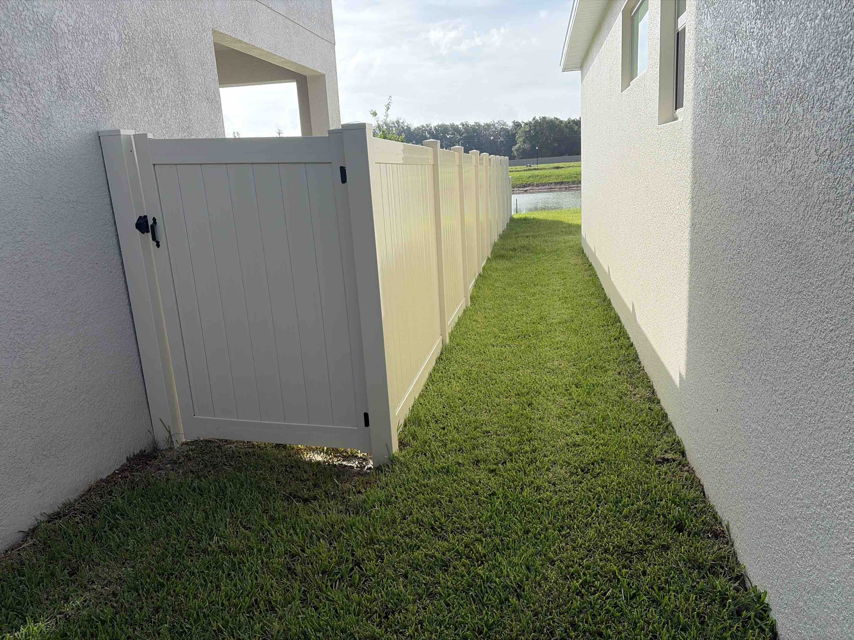 Zephyrhills, FL - Our team meticulously designed and installed a sleek tan vinyl privacy fence, ensuring optimal seclusion and aesthetic appeal. Each section was carefully measured and cut to fit perfectly, with robust posts anchored securely into the ground. The vinyl material was chosen for its durability and low maintenance, providing a long-lasting solution. We paid close attention to detail, ensuring a seamless finish and alignment throughout the entire structure. The final result is a beautiful, functional fence that enhances the property's privacy and curb appeal.