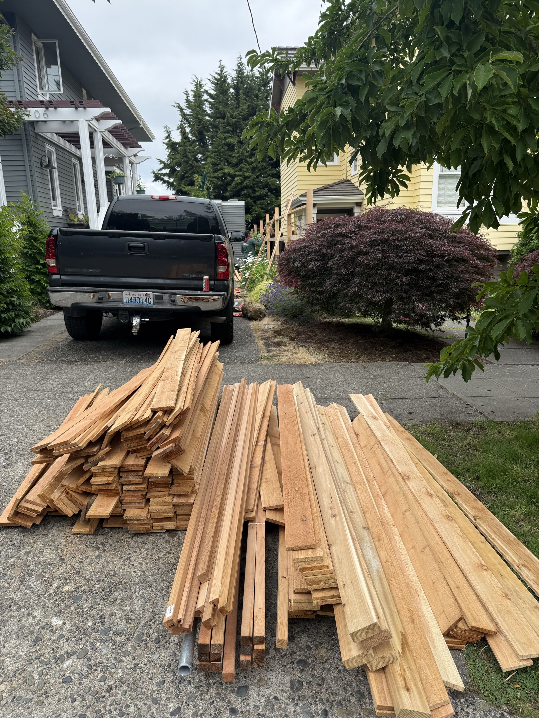 Seattle, WA - Starting a lattice fence with cedar post on pipe in Wallingford.