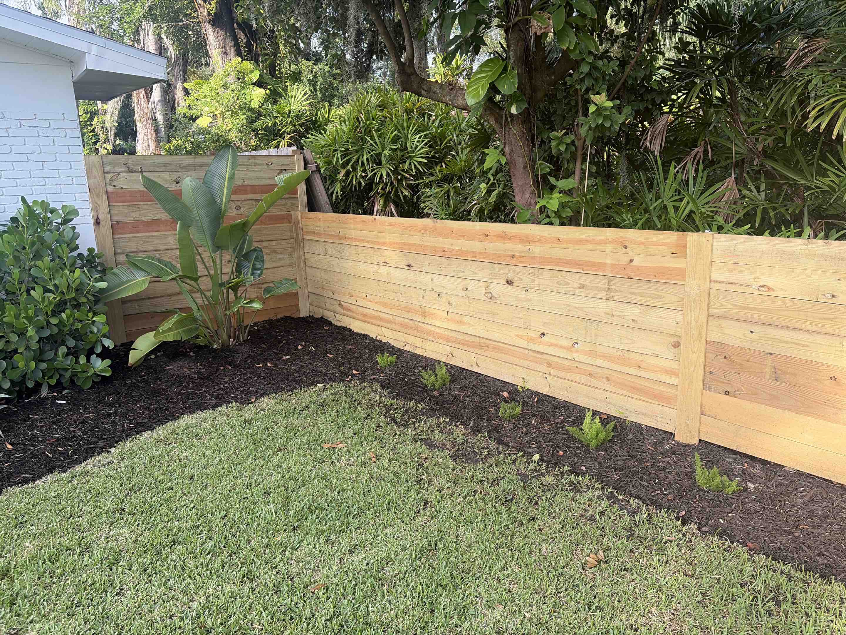 Tampa, FL - Our team meticulously crafted a stunning, modern fence that not only enhances the aesthetic appeal of the property but also ensures complete privacy. We selected high-quality materials and employed expert techniques to create a durable structure that withstands the test of time. The fence features sleek lines and contemporary elements, seamlessly blending with the surrounding environment. Our attention to detail and commitment to excellence resulted in a beautiful, functional barrier that provides peace of mind and seclusion.