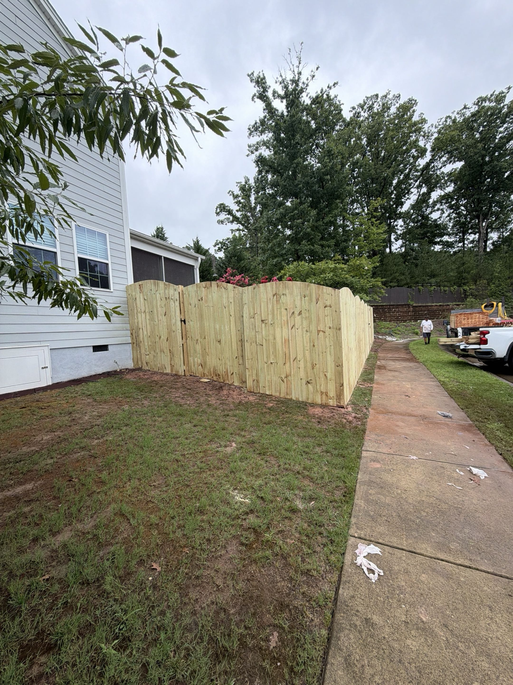Cary, NC - Just completed a stunning local fence installation! We built a custom 90-foot wood arched fence standing a towering 8-feet high for ultimate backyard privacy. This premium wooden fence features elegant arches and three custom single gates for seamless access and maximum curb appeal. Need a trusted local fence contractor to secure and upgrade your property? Contact us today! #WoodFence #PrivacyFence #FenceInstallation #CustomGates #ArchedFence