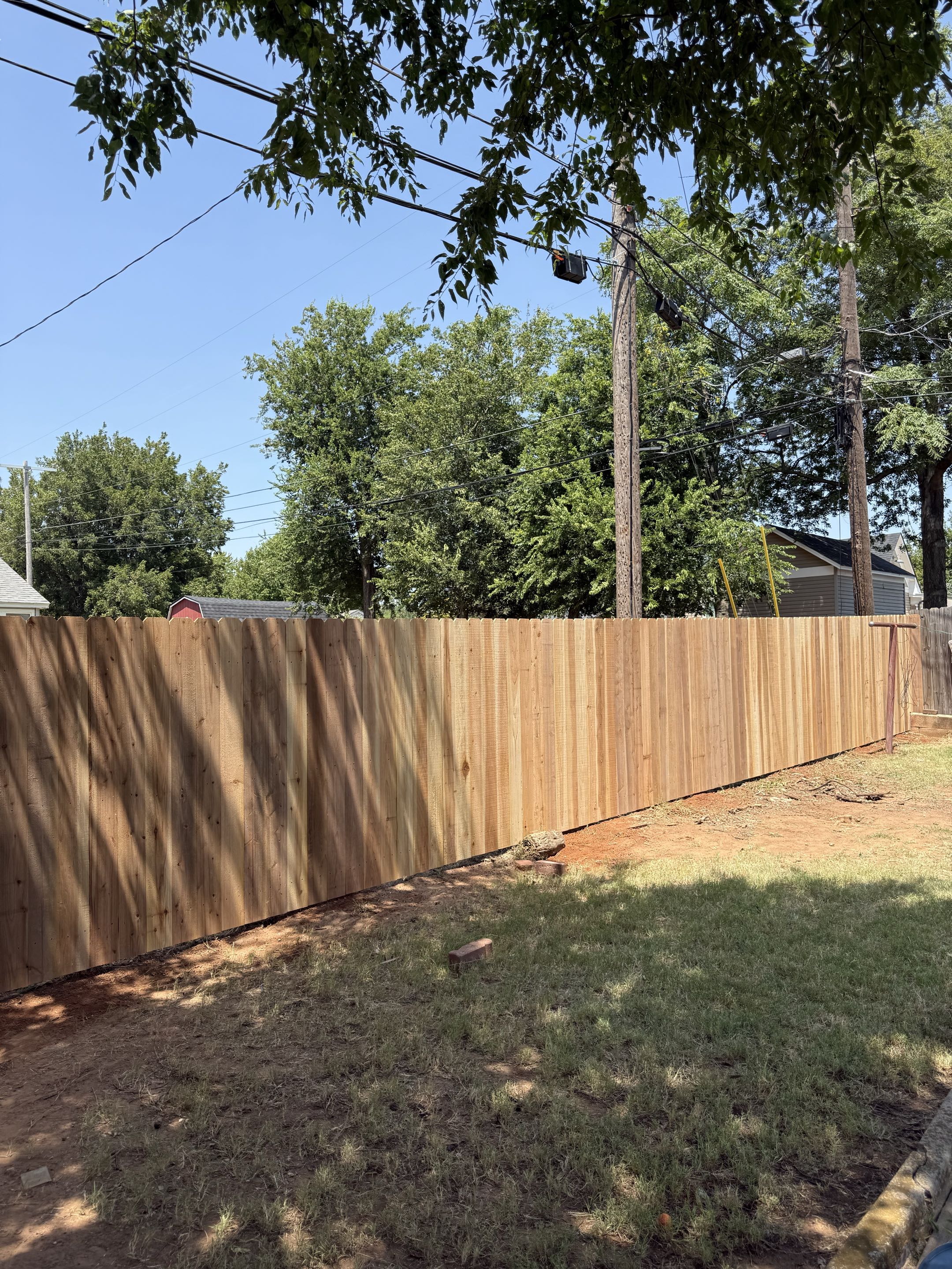 Yukon, OK - Removed the existing back fence line and installed a new 6 ft tall Japanese cedar privacy fence built with quality materials and attention to detail.