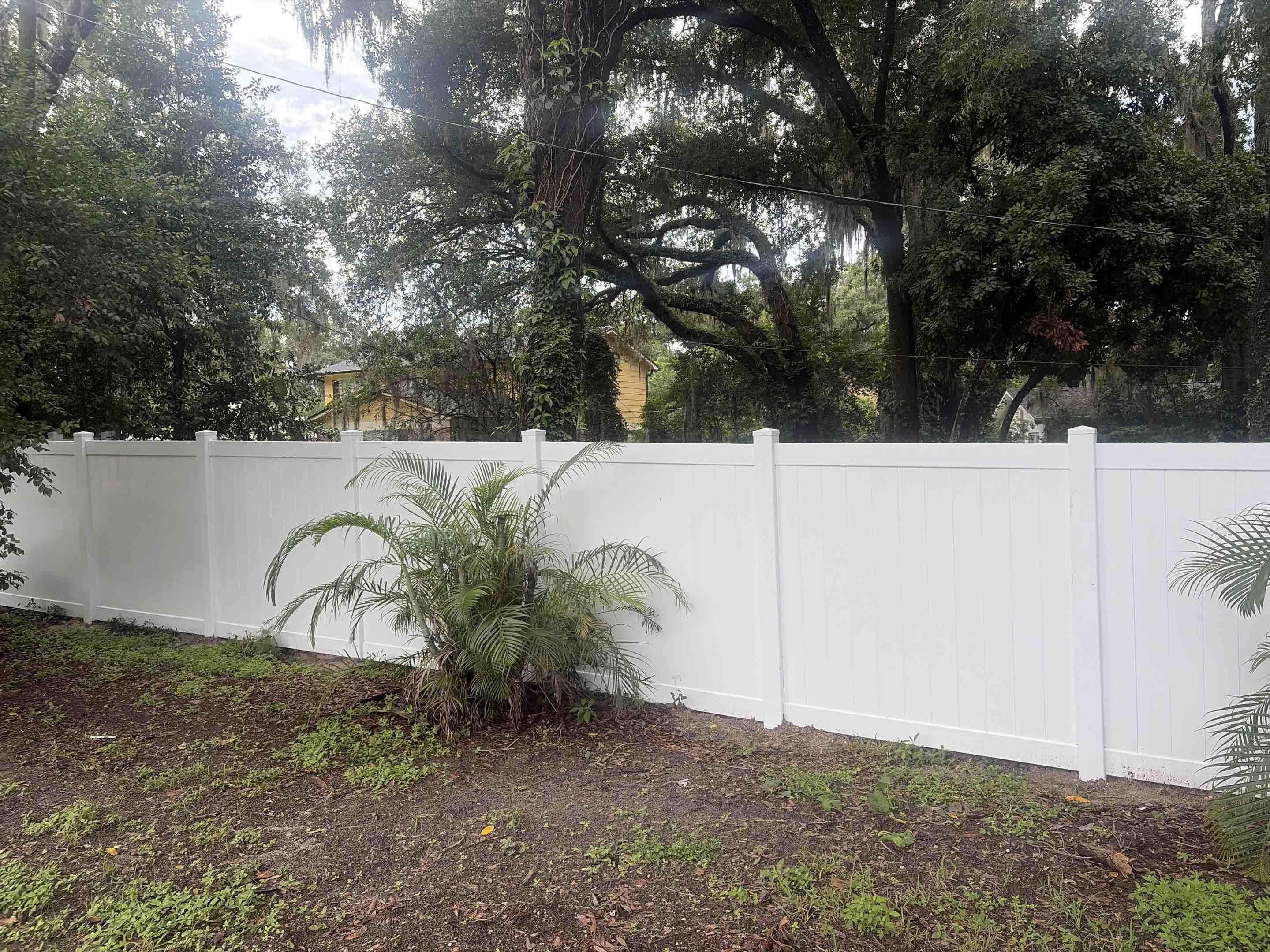 Tampa, FL - Our team successfully constructed a fence in a densely forested area, navigating through thick underbrush and uneven terrain. We carefully selected durable materials to ensure the fence's longevity and resistance to the elements. Each section was meticulously measured and installed, maintaining consistent height and alignment. We took special care to minimize environmental impact, ensuring the natural beauty of the area remained intact. The final result is a robust, aesthetically pleasing fence that blends seamlessly with the surrounding greenery.