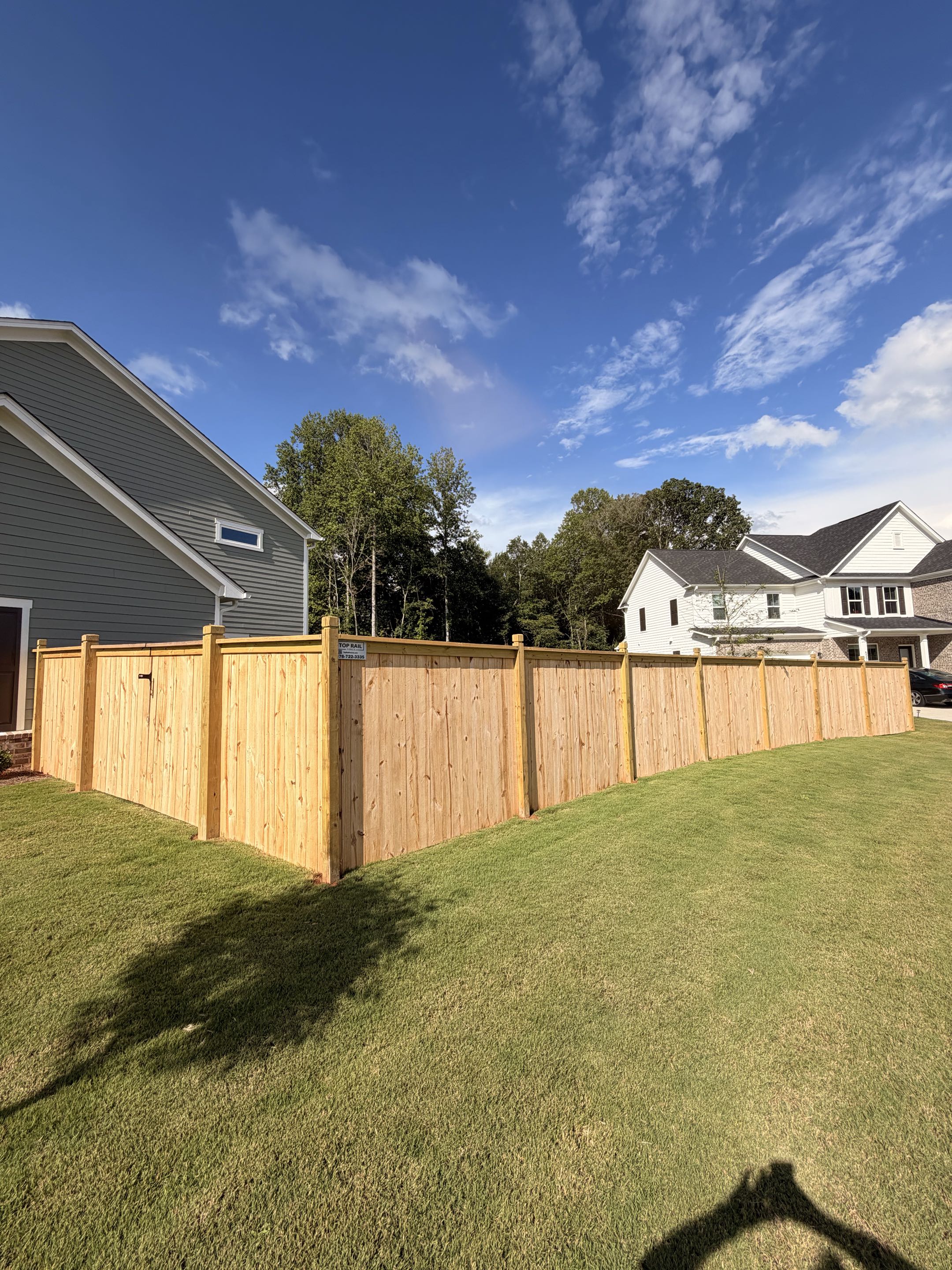 Cumming, GA - We just wrapped up installing this beautiful 300’ Cap and Trim Privacy fence in Cumming. 