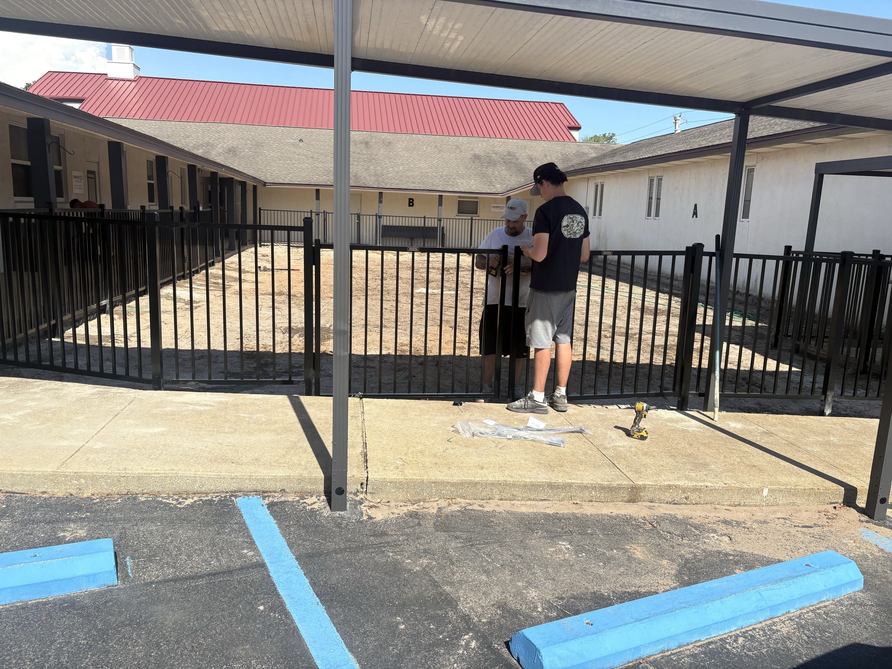 Mary Esther, FL - A beautiful NEW two rail aluminum fence install. This will be a playground at a church soon. It looks amazing!