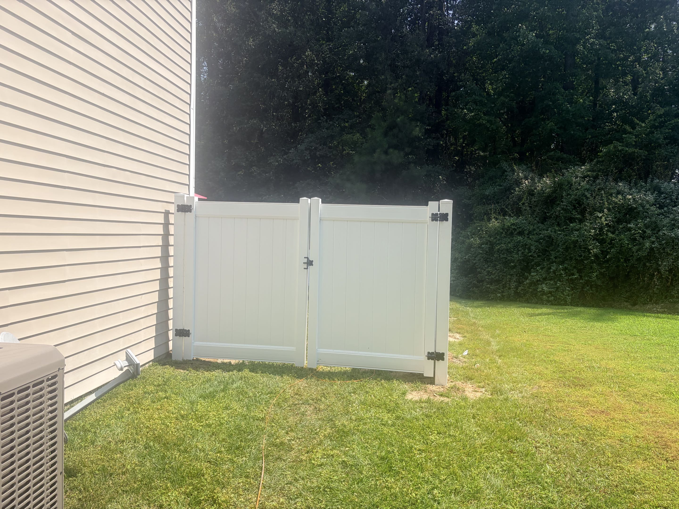 Raleigh, NC - Our team installed a 150-foot stretch of a 6-foot high white vinyl privacy fence, enhancing both the curb appeal and safety of the property. The fence was meticulously crafted to provide privacy and security. We incorporated one double gate and one single gate, ensuring convenient access while maintaining the fence's integrity. The vinyl material was chosen for its durability and low maintenance, promising long-lasting beauty and functionality. Our attention to detail ensured a seamless and professional installation, resulting in a stunning and secure fence.