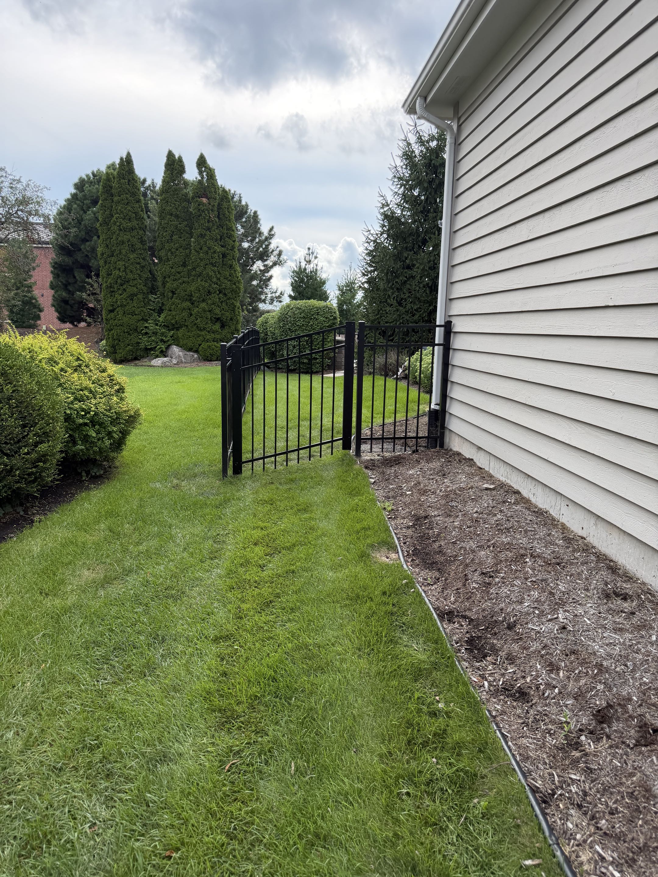 Naperville, IL - A homeowner recently chose our services to install a fence for their new residence. They opted for a 4-foot-tall aluminum fence, painted in a sleek black finish. The fence features custom rack gates, adding both functionality and aesthetic appeal. The homeowner was delighted with the final result, appreciating the modern look and durability of the aluminum material. The installation process was seamless, ensuring the fence met all safety and quality standards. The homeowner's satisfaction was evident, highlighting the importance of attention to detail and craftsmanship in our work.