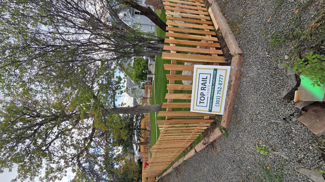 Wheat Ridge, CO - Scalloped picket cedar fence with steel posts will ensure this fence lasts for thes new home owners in wheat ridge. call us for a free estimate!