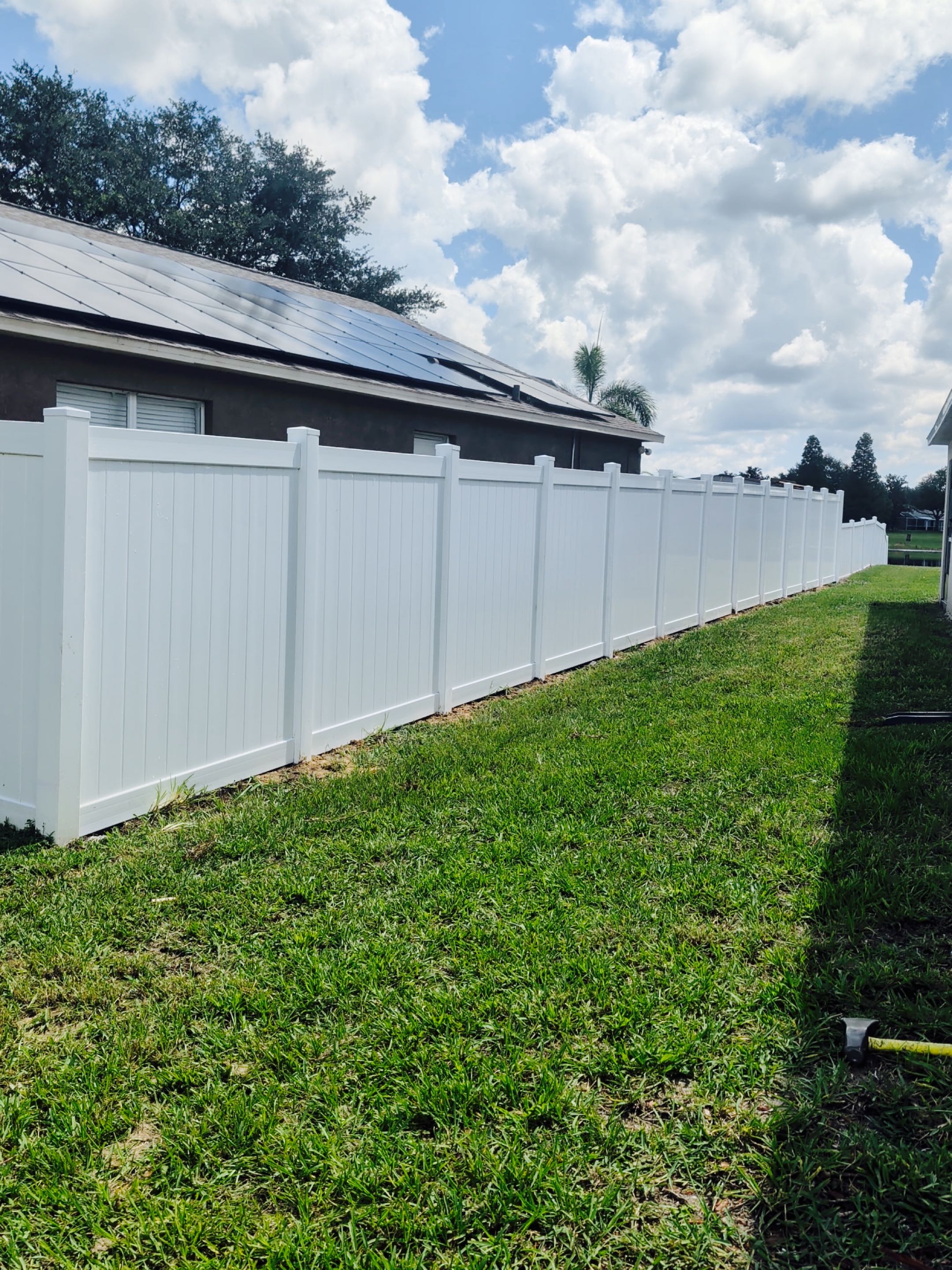 Tampa, FL - Our team meticulously installed a pristine white vinyl fence, ensuring a seamless blend of durability and elegance. Each section was precisely measured and cut to fit the client's specifications, providing both privacy and security. The vinyl material was chosen for its low maintenance and resistance to weathering, promising longevity. Posts were anchored securely into the ground, and the panels were attached with care to maintain a uniform appearance. The final result is a beautiful, functional fence that enhances the property's aesthetic appeal while offering robust protection. Attention to detail was paramount throughout the installation process, ensuring a flawless finish.