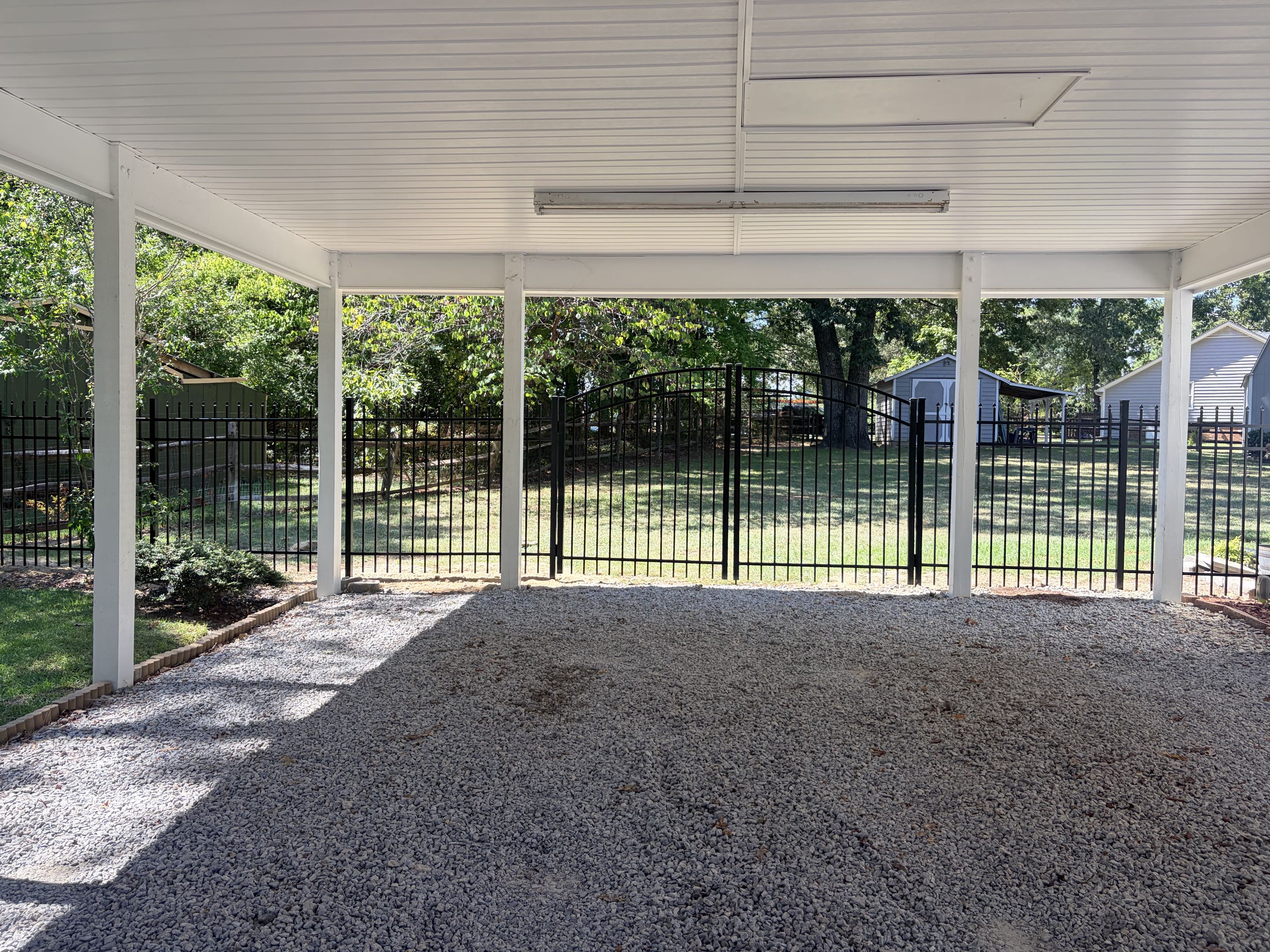 Garner, NC - A recent project involved the installation of 120 feet of a 5-foot-high spear top aluminum rail fence, enhancing both the aesthetic appeal and security of a residential property. The fence was meticulously crafted to provide a sleek, modern look while ensuring durability. Two double arched gates were integrated into the design, offering convenient access while maintaining the fence's robust structure. This installation not only improved curb appeal but also provided an additional layer of security for the homeowner's pet, ensuring their safety and peace of mind. The project was completed with precision, reflecting our commitment to quality and customer satisfaction.