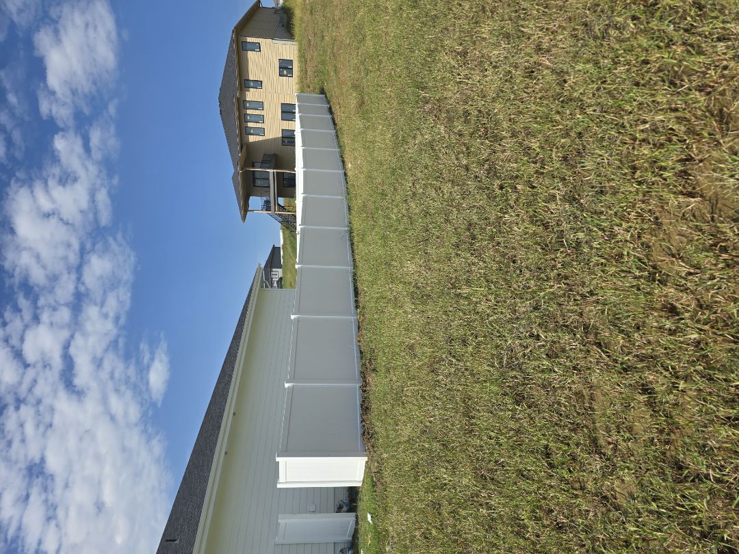 Papillion, NE - We recently completed this 6-foot white vinyl privacy fence, following the grade of the yard for a clean, consistent finish. Vinyl privacy fencing provides a low-maintenance, durable solution while creating a private and polished backyard space. Another great install by Top Rail Fence Omaha!  