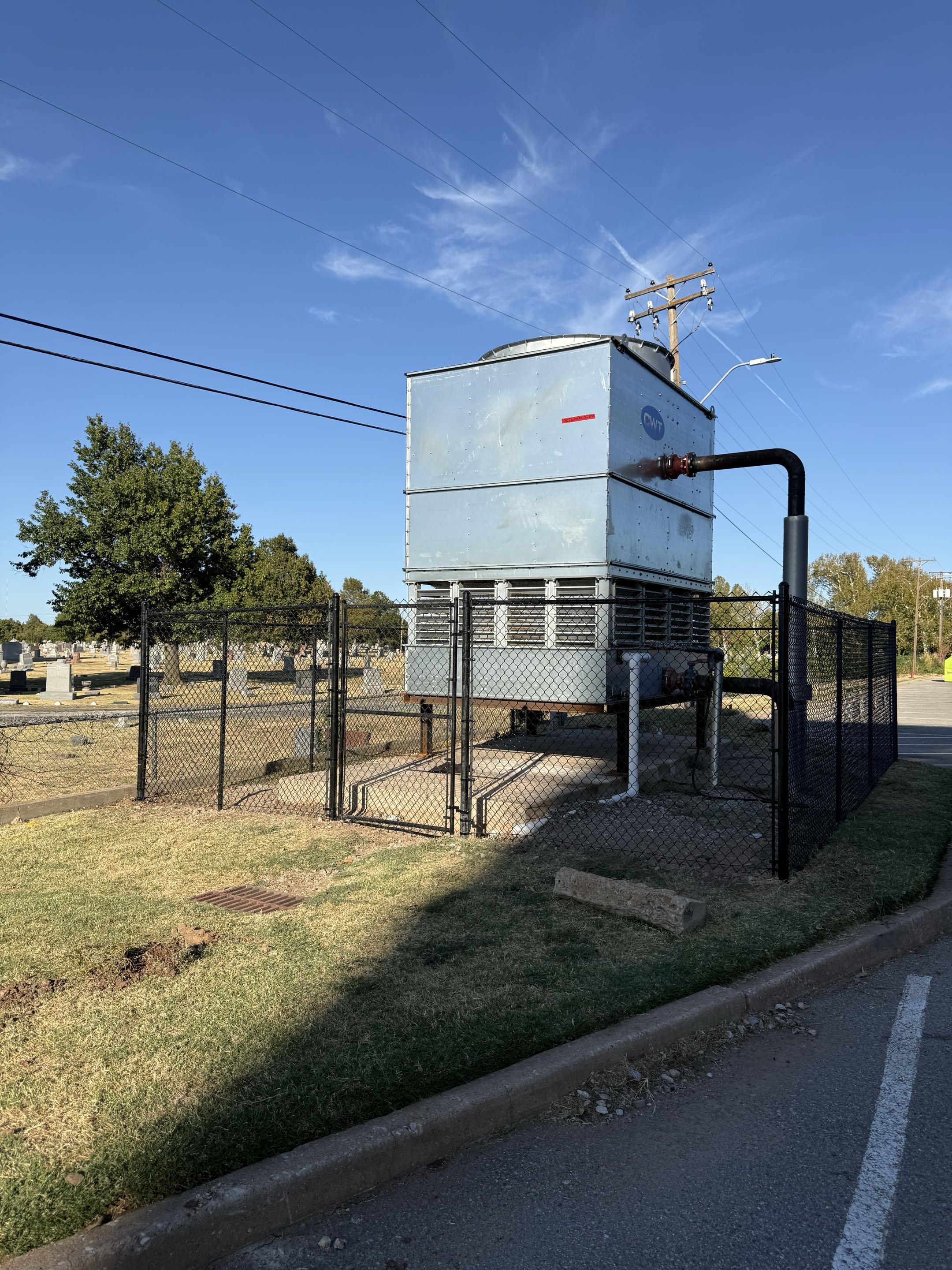 Oklahoma City, OK - This 6 ft tall chain link fence creates a secure enclosure around the water tank unit, helping protect the equipment while maintaining a clean, professional look.