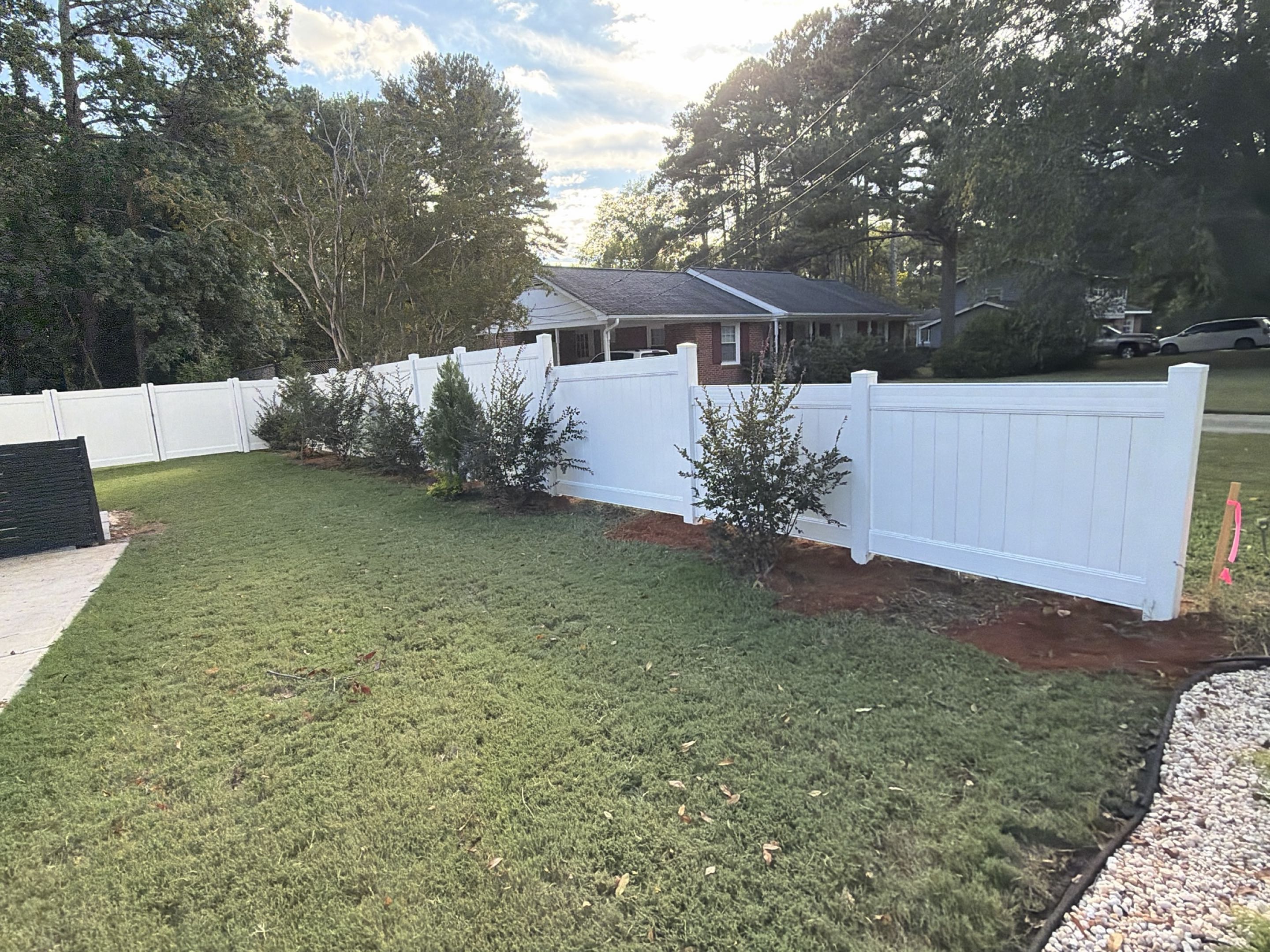 Cary, NC - Another beautiful vinyl fence project complete! This installation features 350 feet of 6’ privacy vinyl fencing, with sections stepped down to 5’ and 4’ for a clean transition. We also installed a large double gate and 5’ walk gate for easy access. Built for privacy, durability, and curb appeal!  #VinylFence #PrivacyFence #FenceInstallation #RaleighNC #RaleighDurham #TriangleNC #TopRailFence #VeteranOwned #WomanOwned