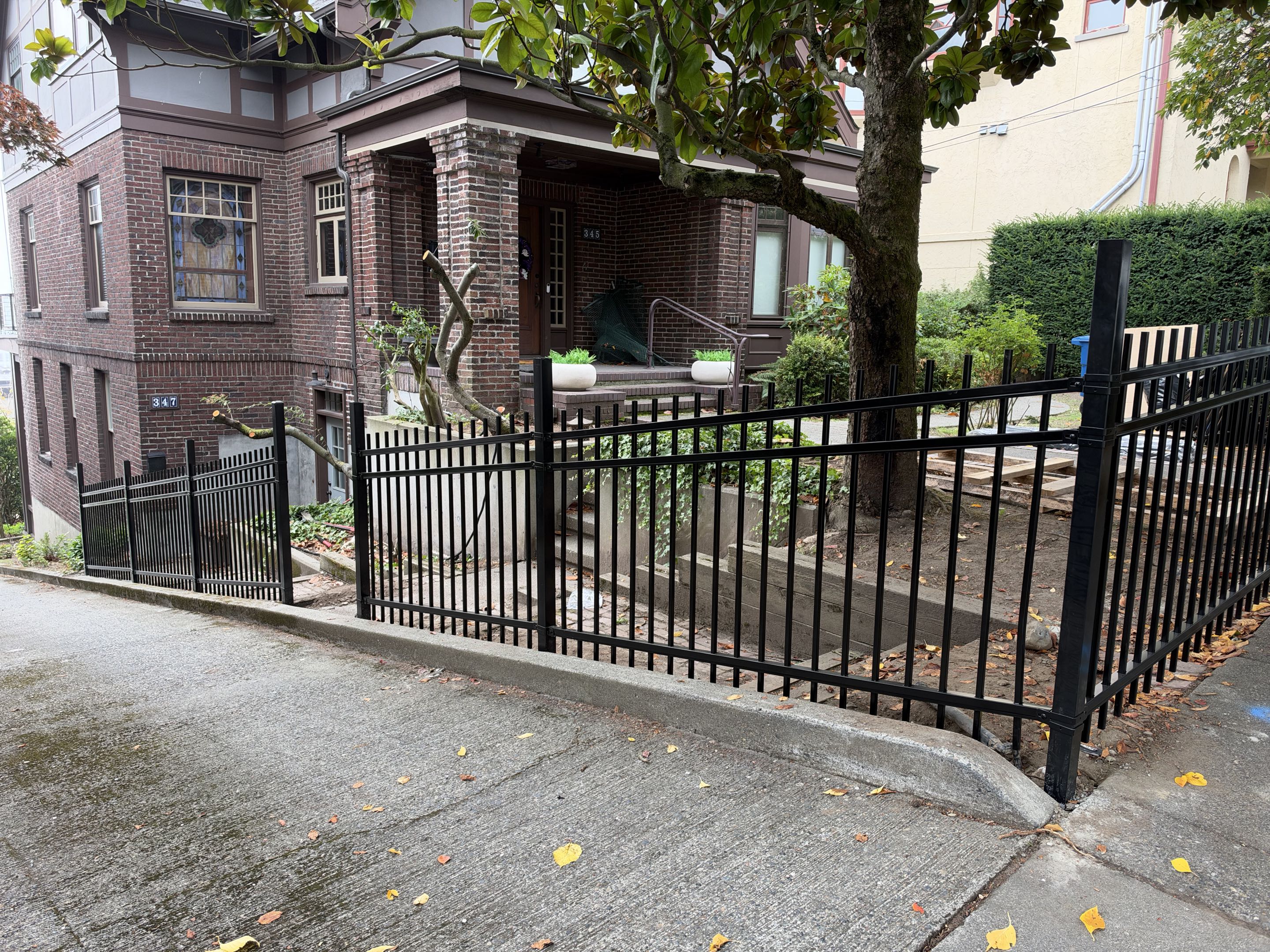 Seattle, WA - Installing an ornamental steel fence in Queen Anne.