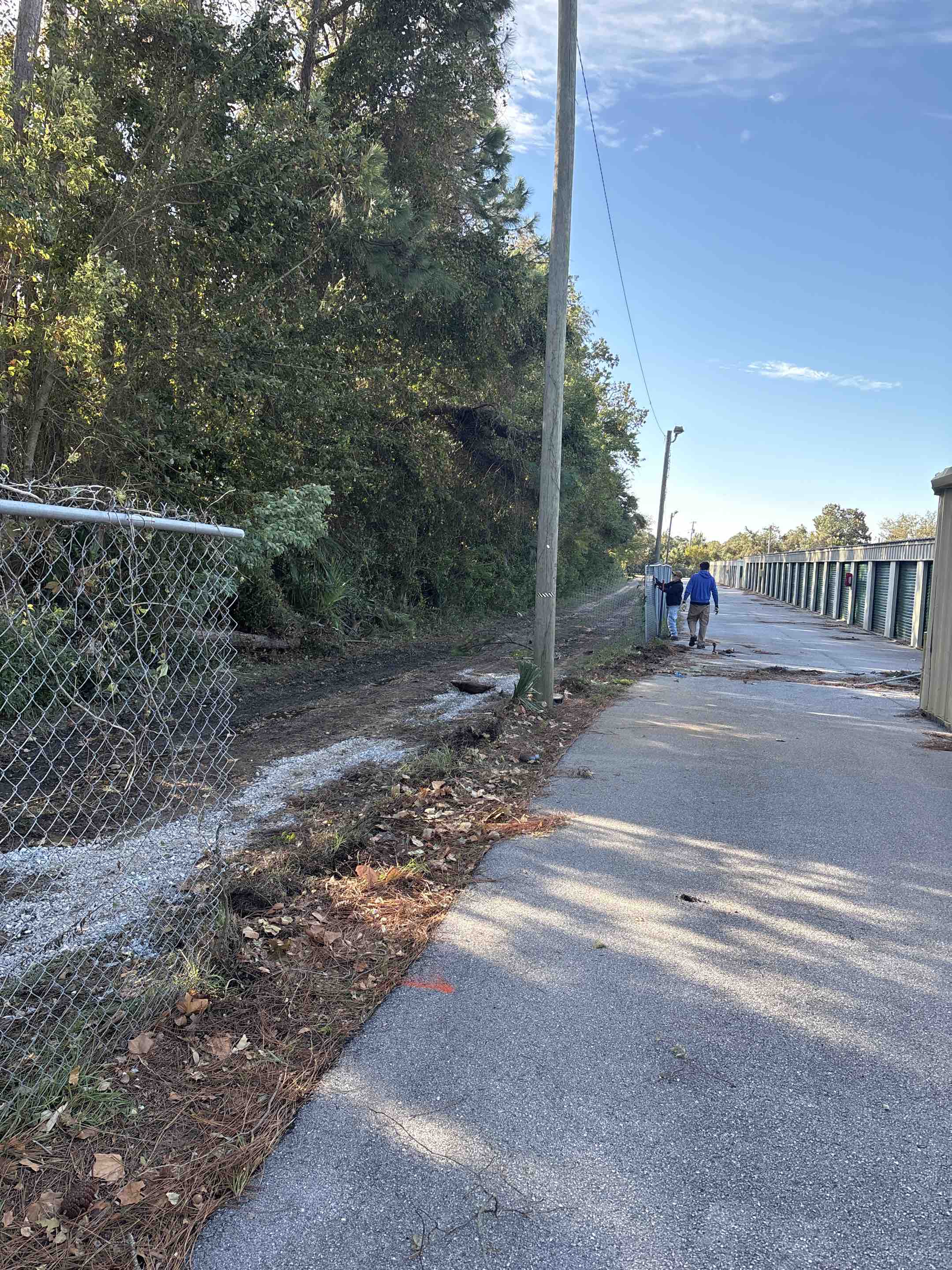 Mary Esther, FL - Working on damaged chain-link at a storage unit. Another satisfied customer!