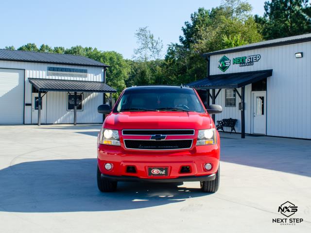 We completed a color change on this Chevrolet Suburban, transforming from the factory gray finish to Gloss Carmine Red using premium Avery Dennison film. To complement the client's Georgia Bulldog aesthetic, the roof and lower side panels were wrapped in gloss black, creating a bold, high-contrast look. The wrap was precision-installed with seamless panel transitions and edge finishing for a factory-grade appearance.  We completed a color change on this Chevrolet Suburban, transforming from the factory gray finish to Gloss Carmine Red using premium Avery Dennison film. To complement the client's Georgia Bulldog aesthetic, the roof and lower side panels were wrapped in gloss black, creating a bold, high-contrast look. The wrap was precision-installed with seamless panel transitions and edge finishing for a factory-grade appearance.
