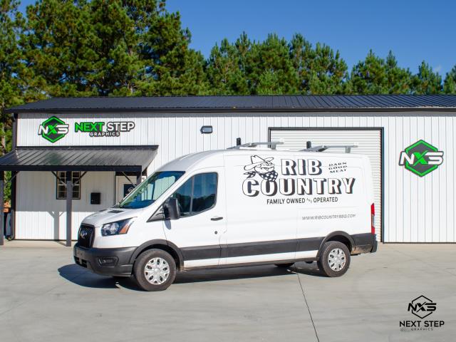 For this project, Rib Country provided their branding and design for their van decals. Our team adapted the layout to fit the dimensions and contours of their new van, ensuring optimal visibility and brand consistency across all surfaces. After finalizing the scaled design, we performed a thorough surface prep, including cleaning and degreasing, to ensure proper adhesion and longevity. The decals were then printed in-house using high performance vinyl suited for outdoor durability. Installation was completed with precision, aligning each element to maintain visual balance and maximize impact on the road.  For this project, Rib Country provided their branding and design for their van decals. Our team adapted the layout to fit the dimensions and contours of their new van, ensuring optimal visibility and brand consistency across all surfaces. After finalizing the scaled design, we performed a thorough surface prep, including cleaning and degreasing, to ensure proper adhesion and longevity. The decals were then printed in-house using high performance vinyl suited for outdoor durability. Installation was completed with precision, aligning each element to maintain visual balance and maximize impact on the road.