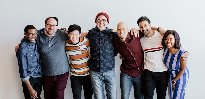 cheerful-diverse-people-embracing