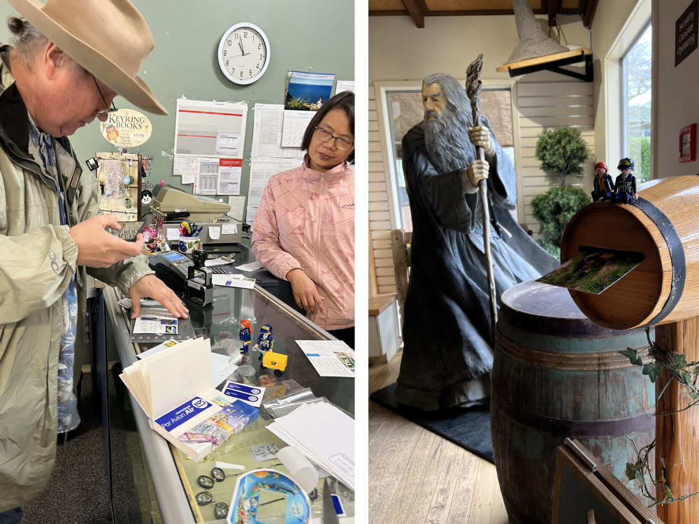 Two small toy figures on a large NZ Post mailbox outside a shop labeled Stationery and Post Centre.