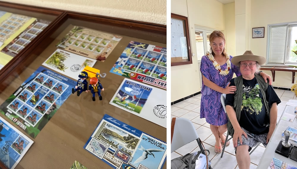 Philatelic counter inside the Wallis post office, with stamp displays and panels on the walls. On the right, Andry and Maret smile, while Maret wears a flower garland