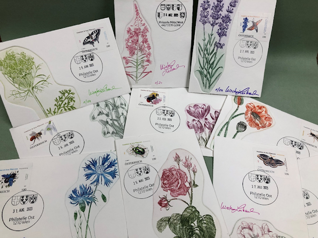 Various postcard-sized prints with images of flowers, stamped and signed