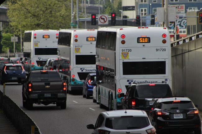 Cars and Double Tall buses on the Stewart Street offramp from the southbound I-5 regular lanes