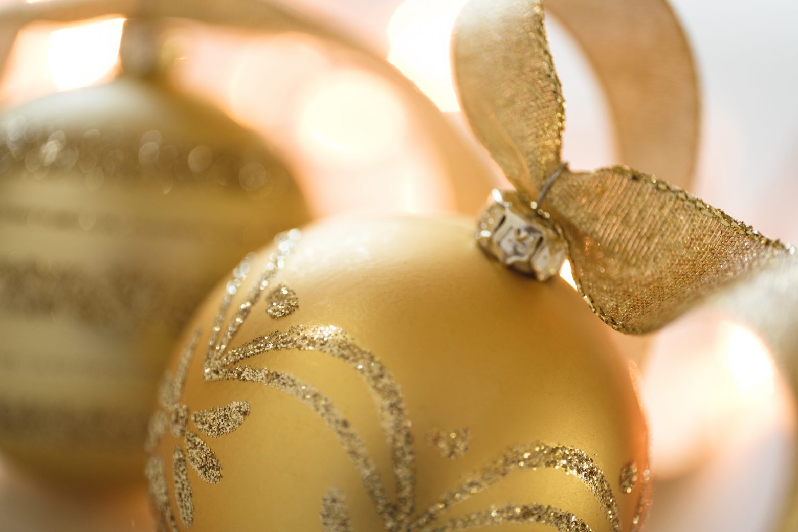 Closeup of gold colored Christmas ornament with designs StockFreedom