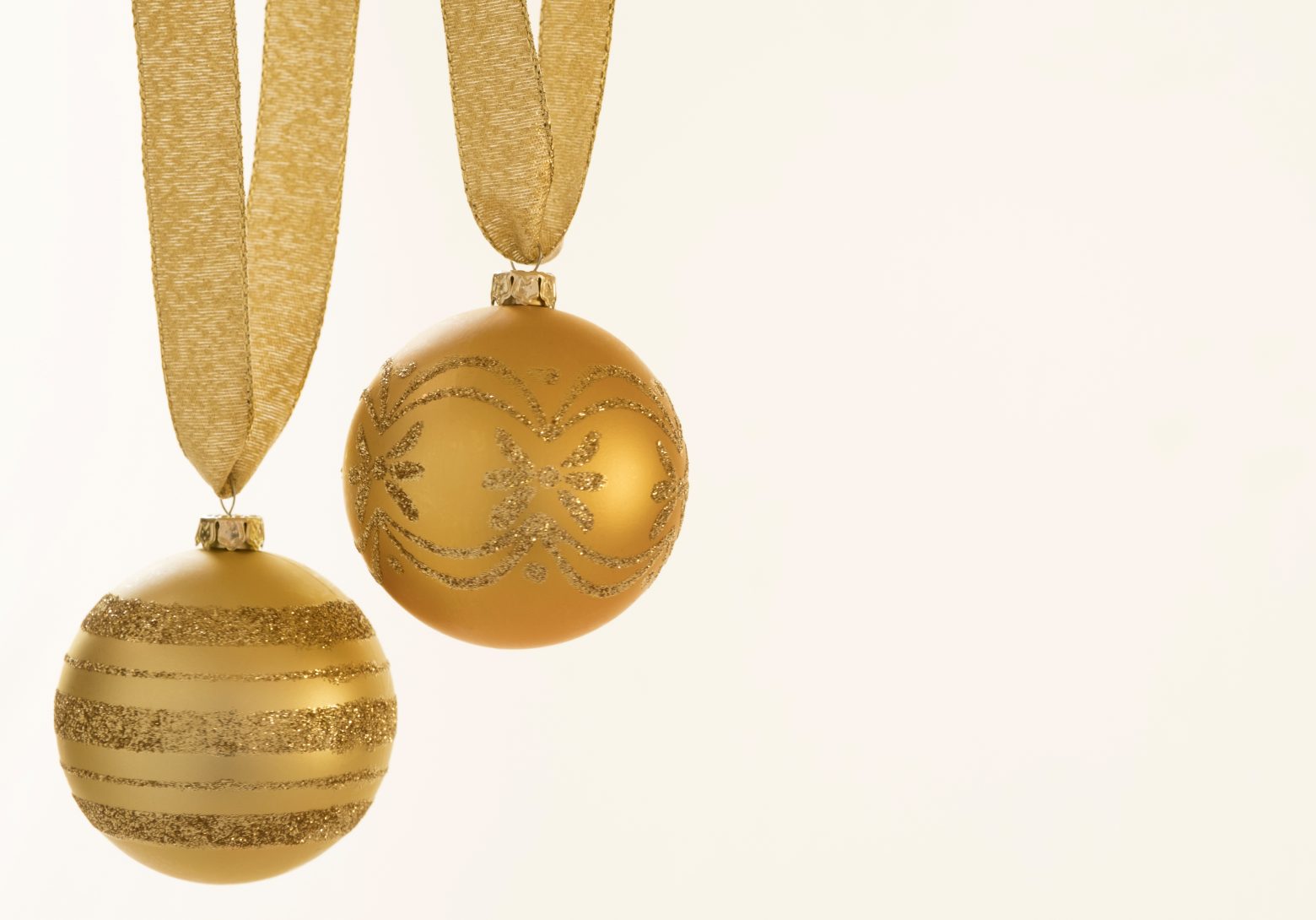 Closeup of gold colored Christmas ornament with designs StockFreedom