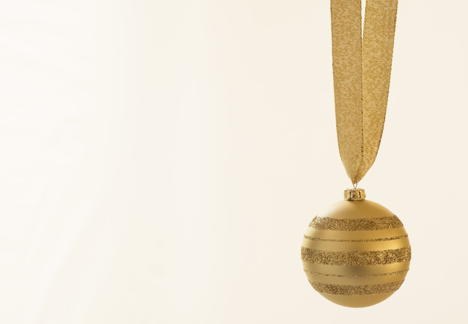 Closeup of gold colored Christmas ornament with designs StockFreedom