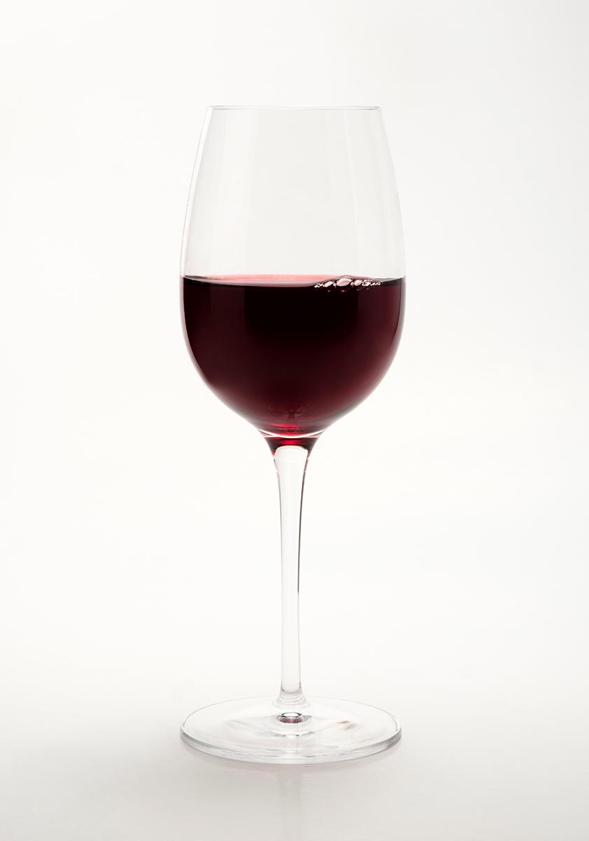 Glass of red wine on a white background StockFreedom Premium Stock