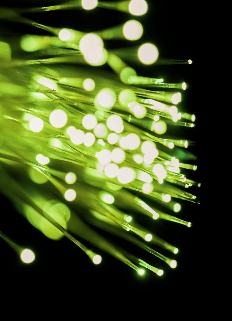 Close up of light passing through fiber optics StockFreedom Premium