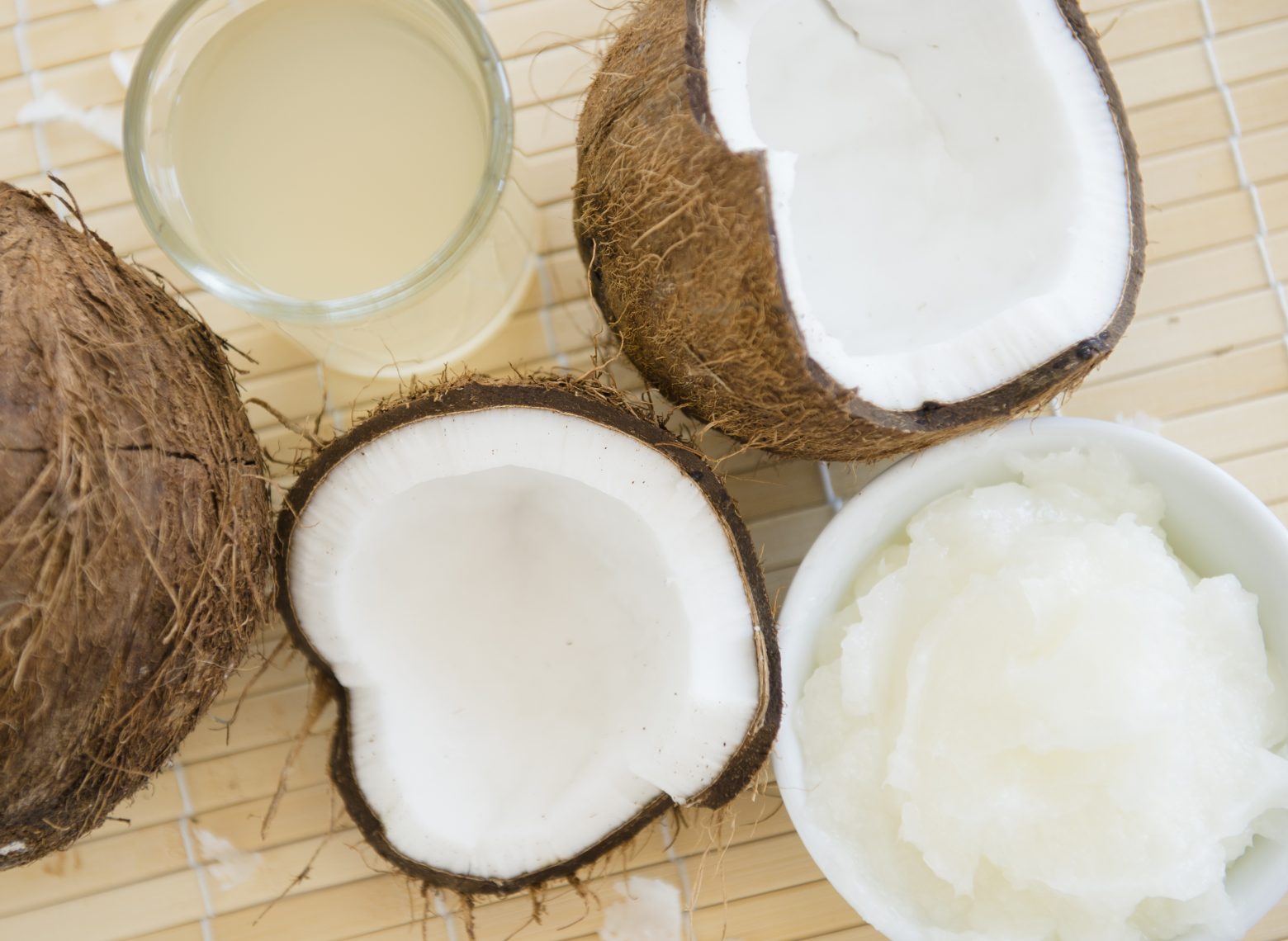Glass of coconut milk with a split coconut StockFreedom Premium