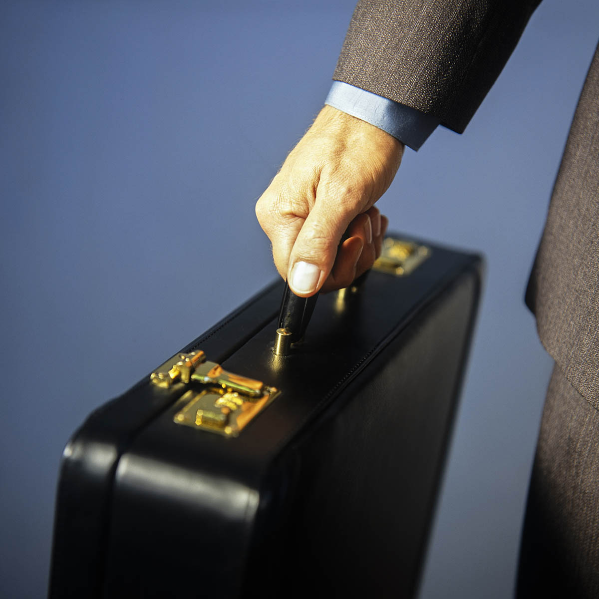 Business man walking with a briefcase StockFreedom Premium Stock