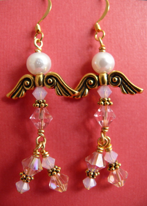 Pink pearls and crystal angel earrings