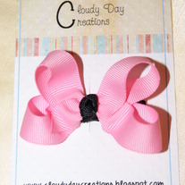 Pink bow w/black center