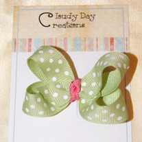 Green bow w/white dots and coral center