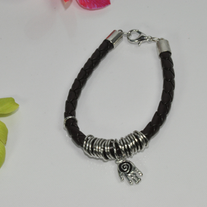 Brown leather bracelet with hand shape metal piece