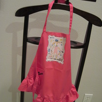 Girl's apron featuring Poodles Galore