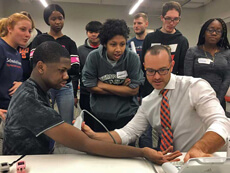Students in exercise science work on a project.