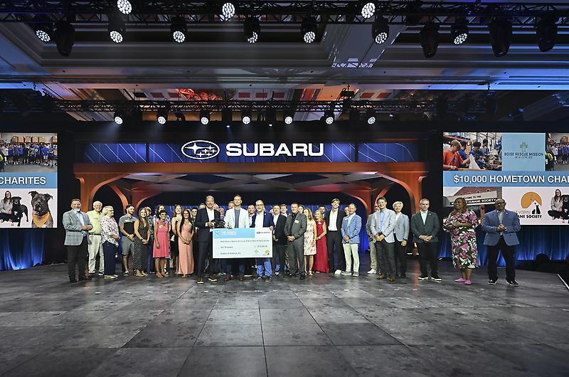 Treasure Valley Subaru employees joined by their family members are presented...