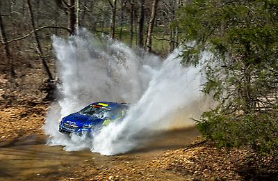 Water erupts out from the #199 Subaru WRX ARA25L.