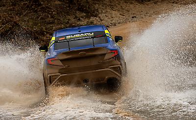 Pastrana and Gelsomino blast through a flooded water crossing.