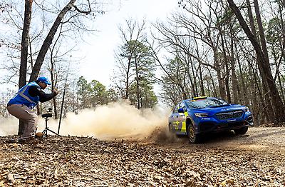 The #199 Subaru WRX leaves a trail of dust behind as it races through the Missouri woods.