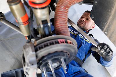 Technician Mark Butler prepares the #199 WRX for its next loop of stages.