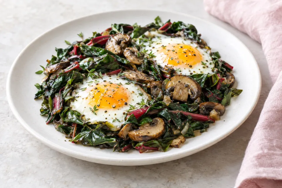 Eggs Nested in Sautéed Chard and Mushrooms