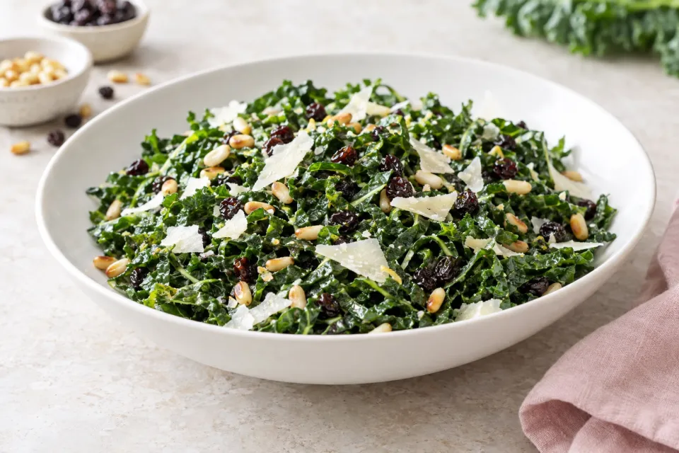 Shredded Kale Salad with Pine Nuts, Currants, and Parmesan
