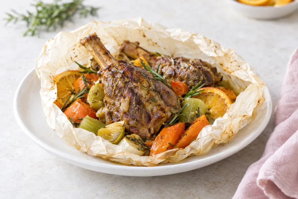 Lamb Shanks En Papillote with Leeks, Carrots, Rosemary, and Orange