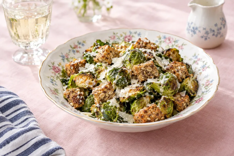 Warm Brussels Sprout Caesar Salad with Multigrain Croutons