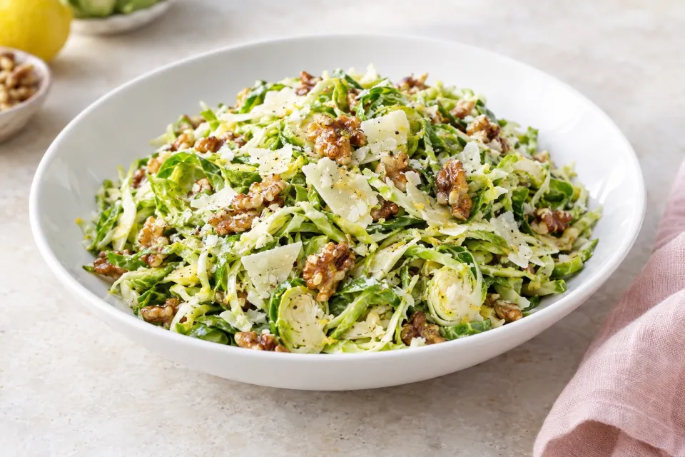 Shredded Brussels Sprout Salad with Romano Cheese Toasted Walnuts and Lemon Vinaigrette