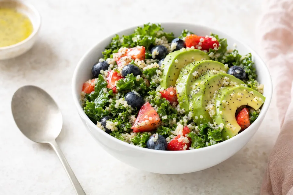 Berry Avocado Quinoa and Kale Salad with Honey-Lime Poppy Seed Dressing