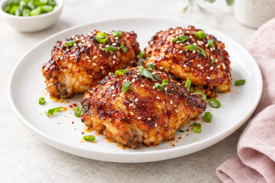 Sweet and Spicy Baked Sriracha Chicken Thighs